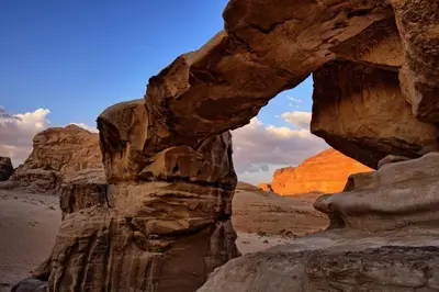 a view of a rock formation in the desert at Rum Cave Tours in Wadi Rum