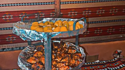 a tray of bananas and other food on a table at Rum Cave Tours in Wadi Rum