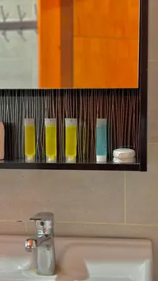 a shelf above a bathroom sink with glasses on it at wadi rum Bubble lunara luxury camp in Wadi Rum