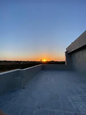 a view of the sunset from the roof of a building at شاليه الدرة Durra Chalet in Amman