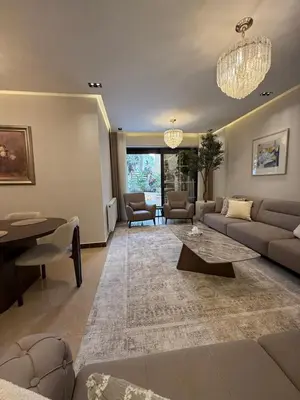 a living room with a couch and a table at مطر in Amman