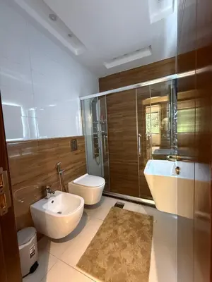a bathroom with a sink and a toilet and a shower at مطر in Amman