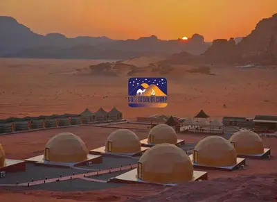 a group of domes in the desert at sunset at Nile bedouin camp in Aqaba