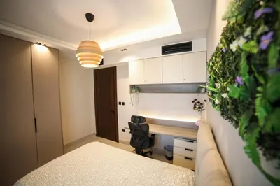 a small room with a desk and a chair at The FWD Living - FWD2 in Amman