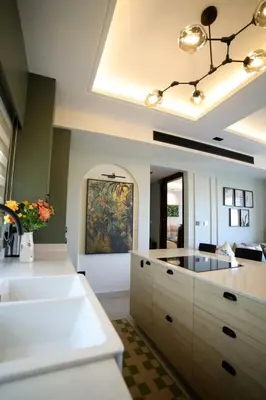 a large kitchen with a sink and a counter at The FWD Living - FWD2 in Amman