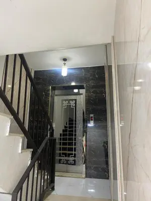 a hallway with a stairway with a stair case at Avatar Hotel-Aqaba in Aqaba