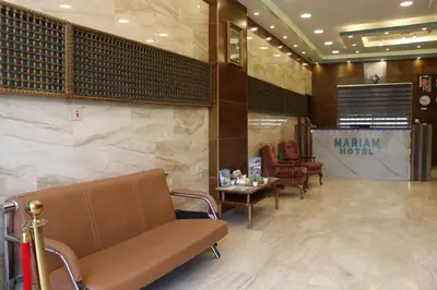 a waiting room with a couch and a table at Mariam Economy Hotel in Aqaba