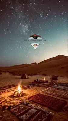 a picture of a desert with a tent and fires at RUM LOREN lUXURY CAMP in Wadi Rum