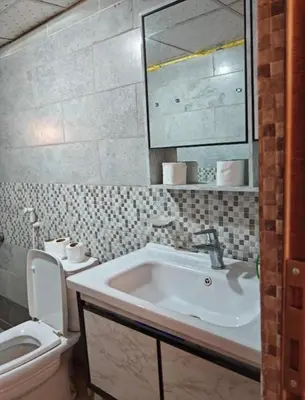 a bathroom with a sink and a toilet at Starlit Wadi Rum camp in Wadi Rum