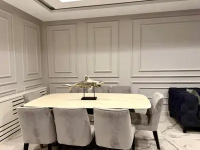 a dining room with a table and chairs at Elegant & Cozy Apartment in Heart of Amman in Amman