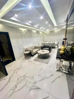 a large living room with a large marble floor at Elegant & Cozy Apartment in Heart of Amman in Amman
