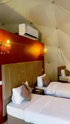 two beds in a room with two beds sidx sidx sidx at Luxury Mars Camp in Wadi Rum