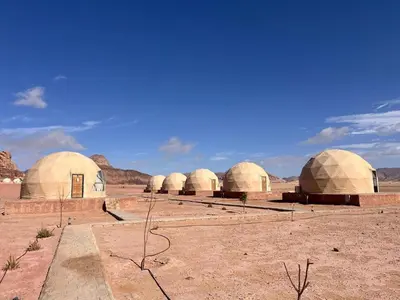 a group of domes in the middle of the desert at Wadi Rum Desert Wonders Camp in Disah