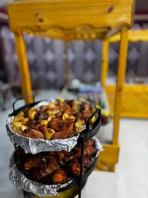 a plate of food sitting on top of a table at Wadi rum maher luxury camp in Wadi Rum