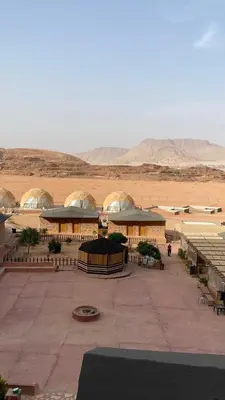 a large building in the middle of the desert at Golden Camp in Wadi Rum