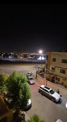 a car parked in a parking lot at night at عبدالرحمن الشطناوي in Aqaba