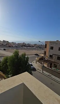 a view of a city with a street and buildings at عبدالرحمن الشطناوي2 in Aqaba