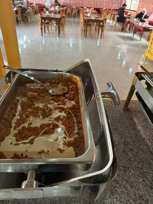 a pan full of food in a restaurant at TAJ luxury Camp in Wadi Rum