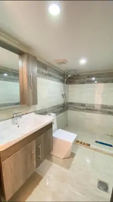 a bathroom with a sink and a shower at Essam camb in Disah