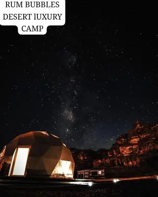 a dome tent under a night sky with the words ruin bubbles desert luxury camp at RUM BUBBLES DESERT lUXURY CAMP in Wadi Rum