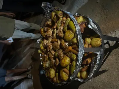a basket full of food with meat and vegetables at Wadi Rum Main Road Visitor Center in Disah