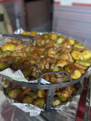 a bunch of food on a tray on a table at Wadi Rum Main Road Visitor Center in Disah