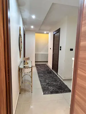 a hallway with a glass table and a door at Irbid in Nāţifah