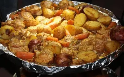 a pie with potatoes and carrots in a pan at Enad wadirum camp in Wadi Rum