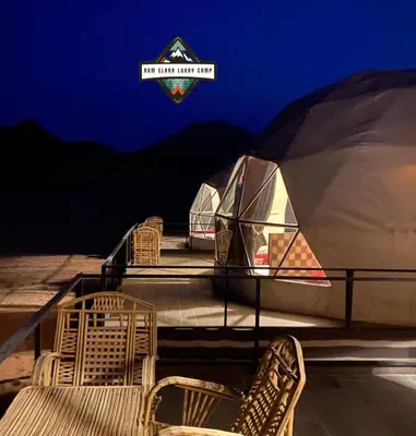 a group of chairs sitting on top of a stage at RUM ELARA lUXRY CAMP in Wadi Rum