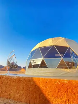 a domed building in the middle of the desert at Essam in Wadi Rum