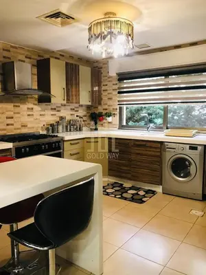 a kitchen with a sink and a dishwasher in it at Chic 2-Bedroom - Fully Furnished in Amman