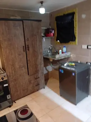 a small kitchen with a sink and a counter at غبار الطلح هاوس in Ma‘ān