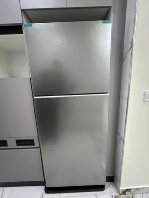 a stainless steel refrigerator in a kitchen at golden apartment - karak in Kerak