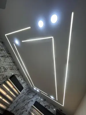 a room with a white ceiling with lights on it at golden apartment - karak in Kerak