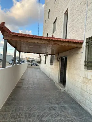 a building with awning on the side of it at golden apartment - karak in Kerak