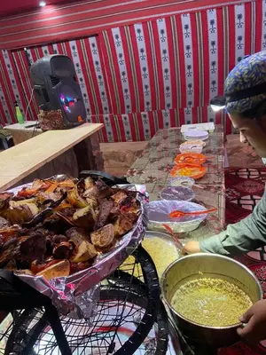 a table with a bunch of food on top at Wadi Rum Nomad Way Camp in Wadi Rum