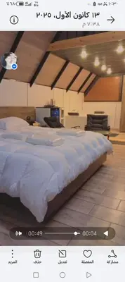 a large white bed in a room with at منتجع وأكواخ غصن in Al Jafr