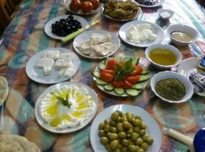 a table with plates of food on a table at Wadi rum camp in Wadi Rum