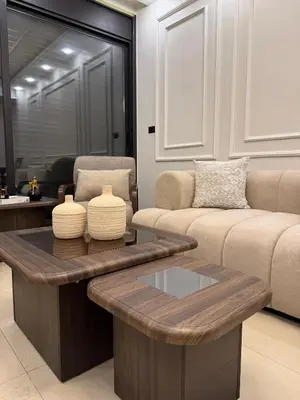 a living room with a couch and a coffee table at Luxury apartment شقة فخمة in Amman