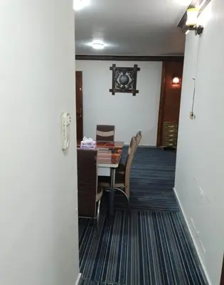 a dining room with a table and chairs at Royal Homes Jordan in Amman