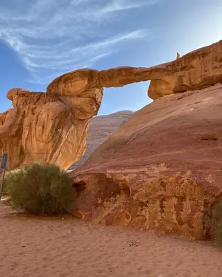 a rock formation in the desert with a mountain at Siella Pearl of Wadi Rum in Wadi Rum