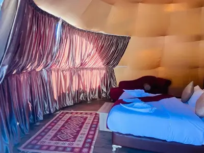 a bedroom with two beds in a tent at Siella Pearl of Wadi Rum in Wadi Rum