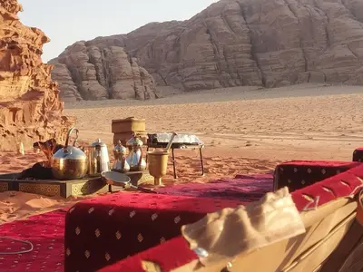 a table in the middle of the desert at Luxury Wadi Rum Camp in Wadi Rum