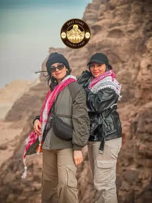 two women standing next to each other on a mountain at DESRT STARS lUXURY CAMP in Disah