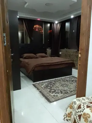 a bedroom with a large bed in a room at شقق تلاع العلي in Amman