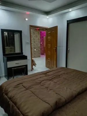 a bedroom with a large bed and a piano at شقق تلاع العلي in Amman