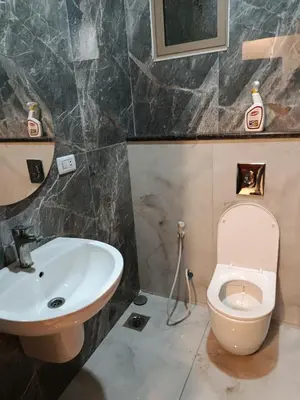 a bathroom with a sink and a toilet at غرفه مفروشه ومكيفه بجانب الكارفور اربد in Irbid