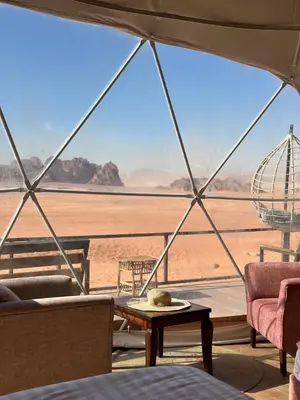 a room with a view of the desert from a tent at Star Gate Camp in Wadi Rum