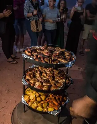 a three tiered tray of food on a table at Echo of the Sands in Wadi Rum