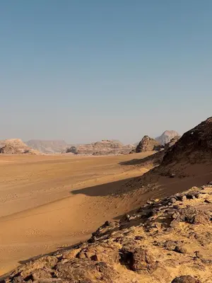 a view of the desert with mountains in the background at Desert Star Camp in Disah